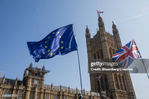 british union flag and european flag - brexit photos et images de collection