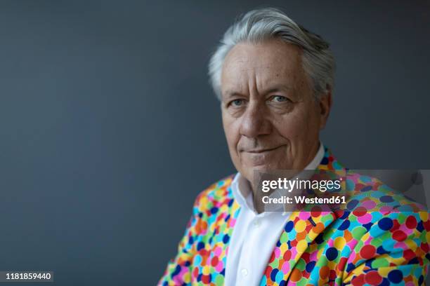 portrait of a senior businessman wearing colorful sports jacket - multi coloured suit stock pictures, royalty-free photos & images