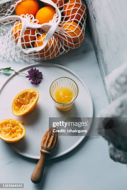 fresh orange juice squeezed in glass - fruit flesh stock pictures, royalty-free photos & images