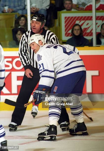 Linesman Leon Stickle and Kirk Muller of the Toronto Maple Leafs skates against the New Jersey Devils during NHL game action on December 10, 1996 at...