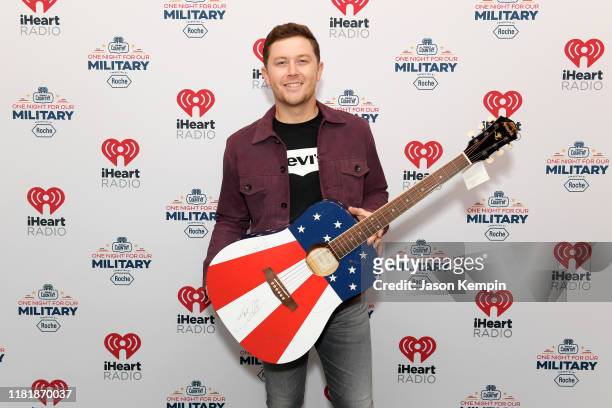 Scotty McCreery backstage at the iHeartCountry One Night For Our Military Presented by Roche at the Country Music Hall of Fame on November 07, 2019...