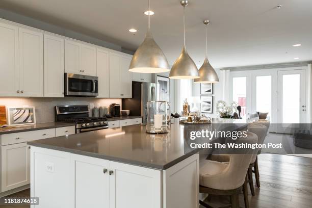 Kitchen Island and Kitchen in the model Townhome at Dream Finders Homes at Glenmont MetroCentre on October 30, 2019 in Silver Spring Maryland.