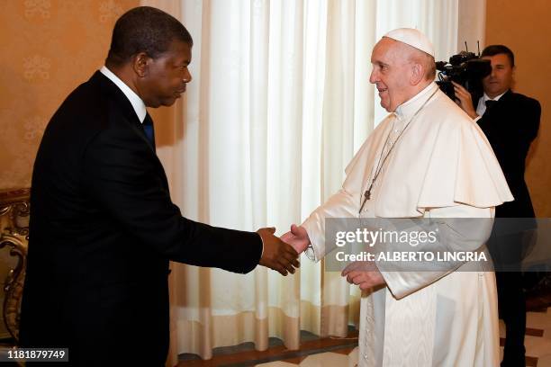 Pope Francis greets Angola's President Joao Lourenco upon his arrival for a private audience at the Vatican on November 12, 2019.