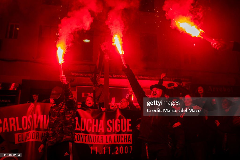 Anti-fascists marching with flares, remembering Carlos...