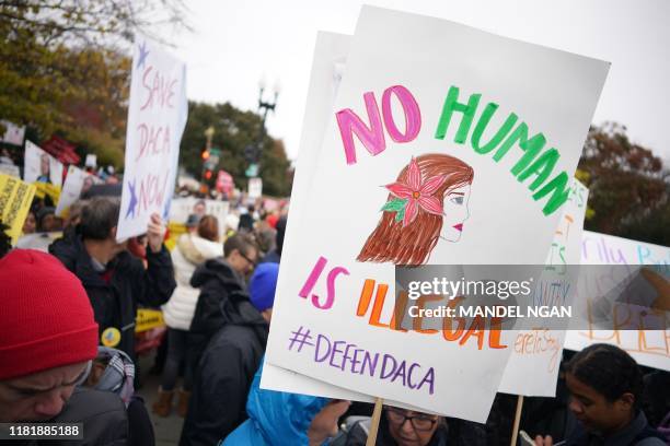 Immigration rights activists take part in a rally in front of the US Supreme Court in Washington, DC on November 12, 2019. - The US Supreme Court...