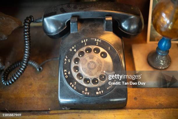 the telephone antique display. - antique phone stock-fotos und bilder