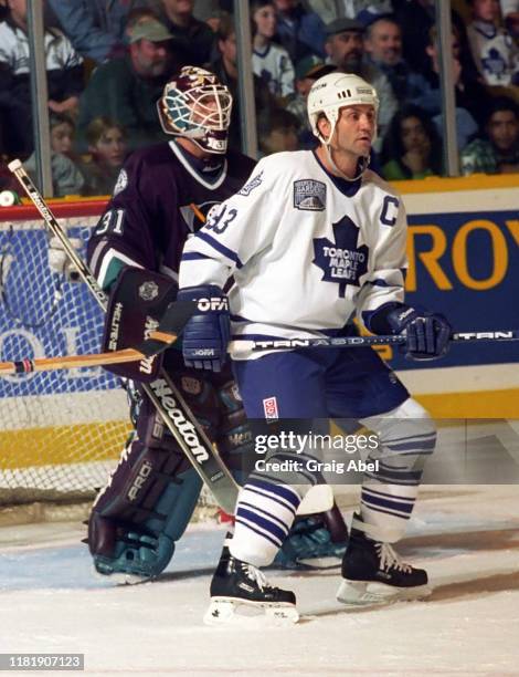 Doug Gilmour of the Toronto Maple Leafs skates against Guy Hebert of the Mighty Ducks of Anaheim during NHL game action on October 5, 1996 at Maple...