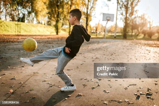 the future soccer champion - street football stock pictures, royalty-free photos & images