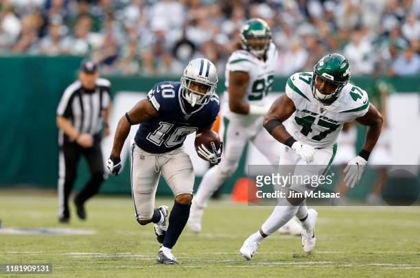 Tavon Austin of the Dallas Cowboys in action against Albert McClellan of the New York Jets at MetLife Stadium on October 13, 2019 in East Rutherford,...