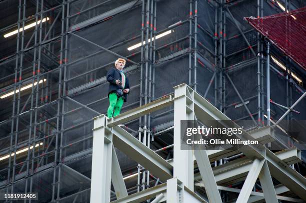 Extinction Rebellion environmental activist Ben Atkinson is seen free climbing the Big Ben clock tower to drop banners highlighting political...