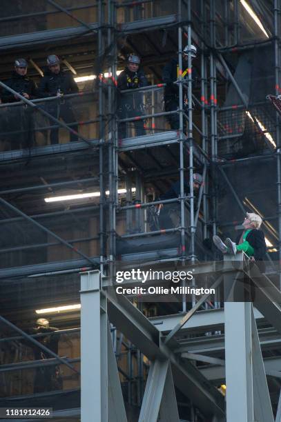 Extinction Rebellion environmental activist Ben Atkinson is seen free climbing the Big Ben clock tower to drop banners highlighting political...