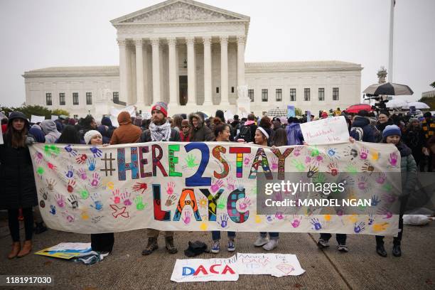 Immigration rights activists take part in a rally in front of the US Supreme Court in Washington, DC on November 12, 2019. - The US Supreme Court...