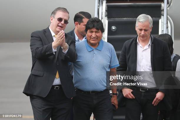 Former Bolivian president Evo Morales is greeted by Secretary of Foreign Affairs of Mexico Marcelo Ebrard as he arrives at Benito Juarez...