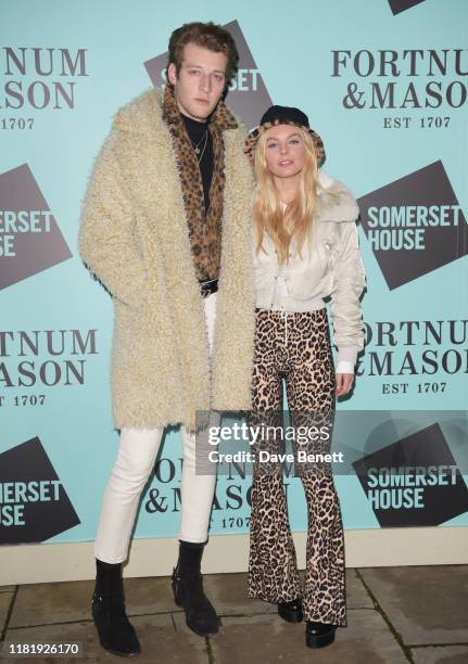 Jake Chatterton and Nell Hudson attend the opening party of Skate at Somerset House on November 12, 2019 in London, England. Celebrating its 20th...