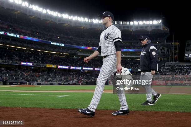 James Paxton of the New York Yankees walks back to the dugout prior to game five of the American League Championship Series against the Houston...