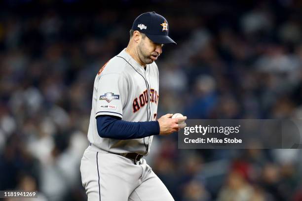 Justin Verlander of the Houston Astros reacts after giving up a home run to DJ LeMahieu of the New York Yankees during the first inning in game five...