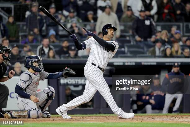 Aaron Hicks of the New York Yankees hits a three run home run against Justin Verlander of the Houston Astros during the first inning in game five of...