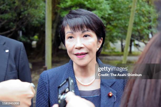 Internal Affairs And Communications Minister Sanae Takaichi speaks to media as she visits Yasukuni Shrine on October 18, 2019 in Tokyo, Japan.