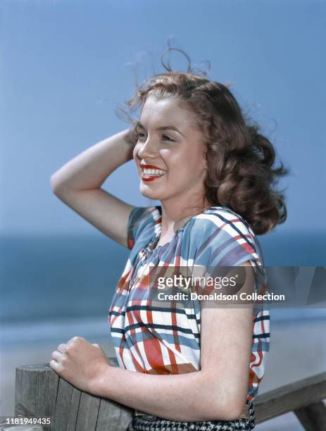 Actress Marilyn Monroe then known as Norma Jeane Mortenson poses for a portrait in 1946 in Los Angeles, California.