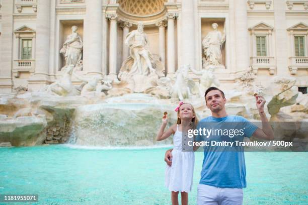 happy family enjoy their italian vacation holiday in europe - coin fountain imagens e fotografias de stock