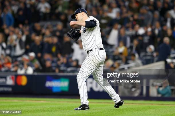 James Paxton of the New York Yankees reacts after retiring the Houston Astros during the eighth inning in game five of the American League...