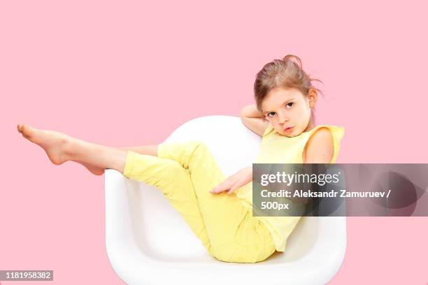 stylish little girl in yellow n pink - n n girl models stockfoto's en -beelden