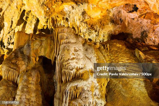 inside of beautiful dark cave - cave system stockfoto's en -beelden