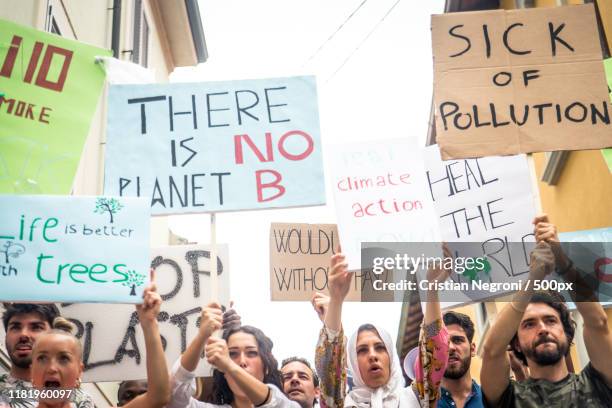 public demonstration on the street against global warming - climate demonstration stock pictures, royalty-free photos & images