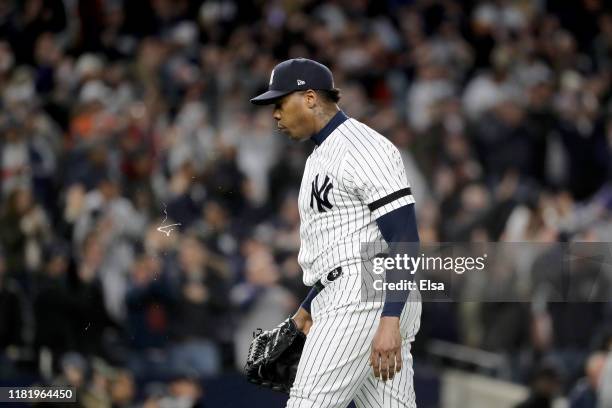 Aroldis Chapman of the New York Yankees reacts after defeating the Houston Astros in game five of the American League Championship Series with a...