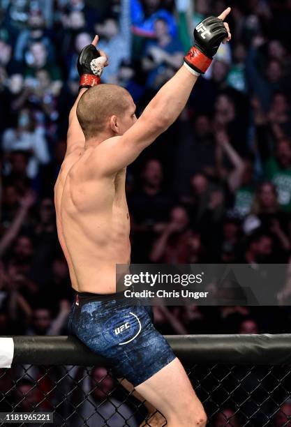 Joe Lauzon celebrates after his TKO victory over Jonathan Pearce in their lightweight bout during the UFC Fight Night event at TD Garden on October...