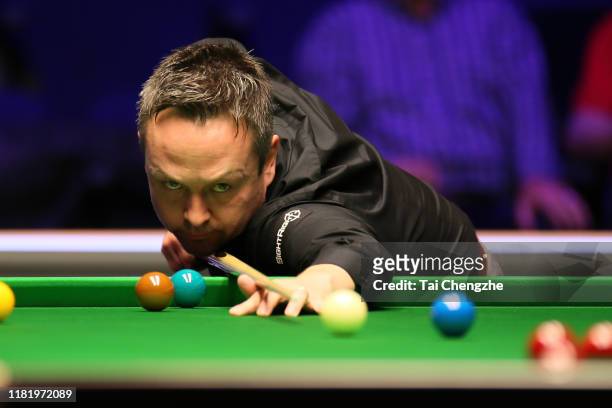 Lee Walker of Wales plays a shot in the quarter-final match against Mark Allen of Northern Ireland on day five of 2019 English Open at K2 Leisure...
