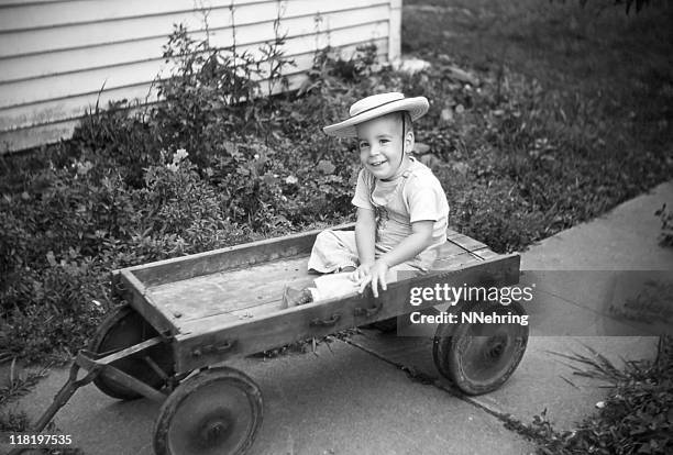 boy in old wagon 1954, retro - 1954 bildbanksfoton och bilder