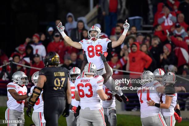 Jeremy Ruckert of the Ohio State Buckeyes celebrates with teammates after scoring a touchdown in the fourth quarter against the Northwestern Wildcats...