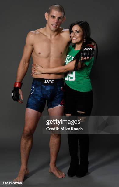 Joe Lauzon poses for a portrait backstage with his wife after his victory during the UFC Fight Night event at TD Garden on October 18, 2019 in...