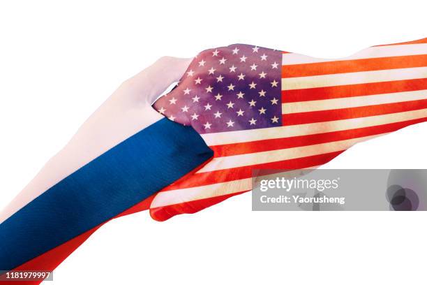 concept photo:usa handshake with russia ,world peace - usa russia stock-fotos und bilder