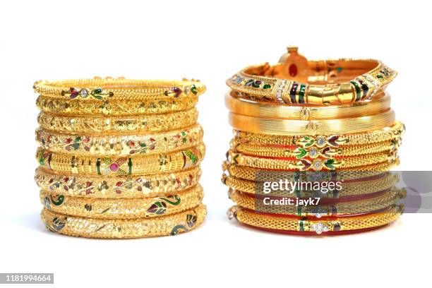 gold jewellery - armreif stock-fotos und bilder