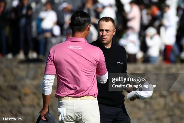 Justin Thomas of the United States and Danny Lee of New Zealand shake hands after holing out on the 18th green during the third round of the CJ Cup...