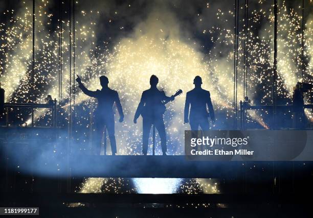 Recording artists Nick Jonas, Kevin Jonas and Joe Jonas of Jonas Brothers perform during a stop of the group's Happiness Begins Tour at MGM Grand...