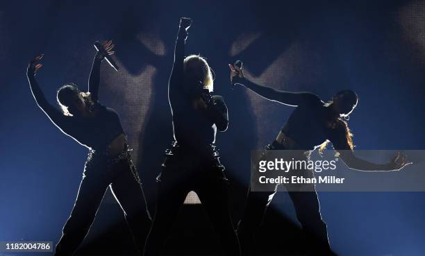 Recording artist Bebe Rexha performs with singer/dancers Ari Rosado and Randi Liberman as they open for Jonas Brothers during a stop of the group's...