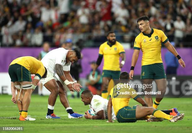 Kyle Sinckler of England celebrates with Manu Tuilagi as he scores his team's third try during the Rugby World Cup 2019 Quarter Final match between...