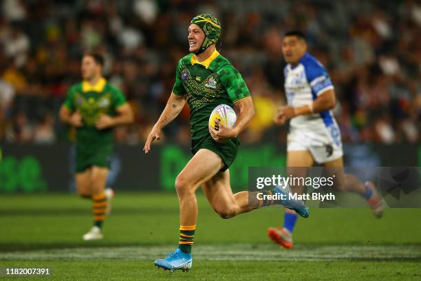 Kalyn Ponga of Australia makes a break to score a try during the Semi Final Rugby League World Cup 9s match between Australia and Samoa at Bankwest...