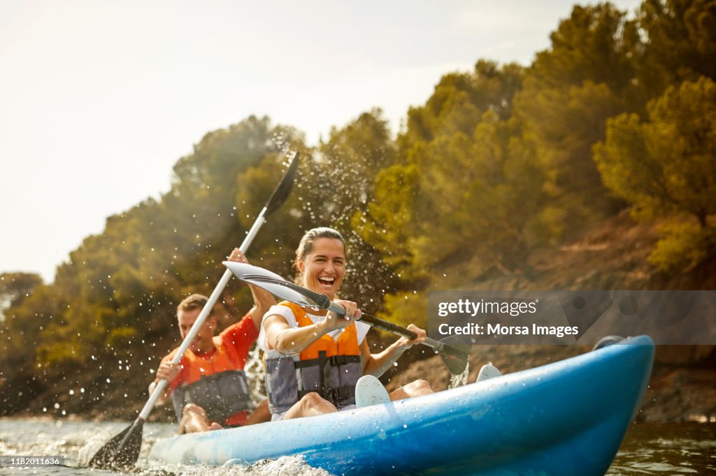 Cheerful couple enjoying kayaking