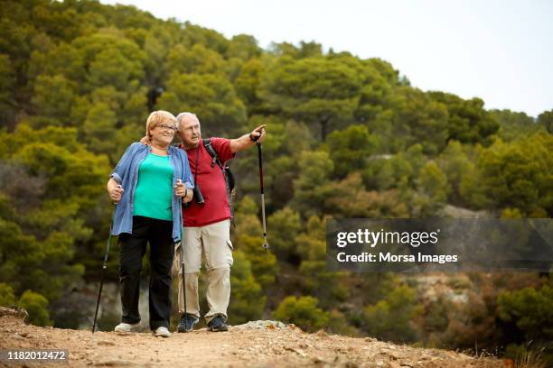 elderly couple hiking together on mountain - pensioners demonstrate in barcelona stock pictures, royalty-free photos & images