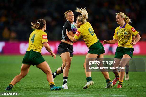 Krystal Rota of New Zealand is tackled during the Rugby League World Cup 9s Womens Final match between New Zealand and Australia at Bankwest Stadium...