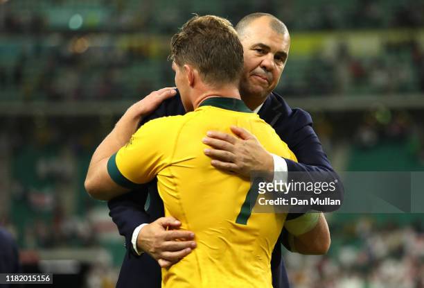 Michael Cheika, Head Coach of Australia and Michael Hooper of Australia embrace following the Rugby World Cup 2019 Quarter Final match between...