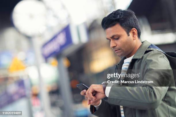 man waiting for the train at the platform - indian arrival stock pictures, royalty-free photos & images