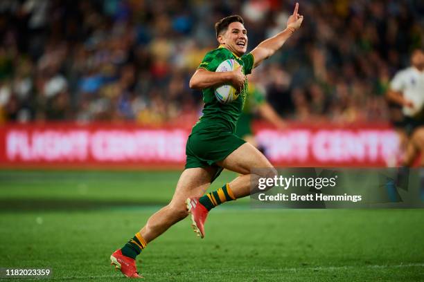 Mitchell Moses of Australia scores a try during the Final Rugby League World Cup 9s match between Australia and New Zealand at Bankwest Stadium on...