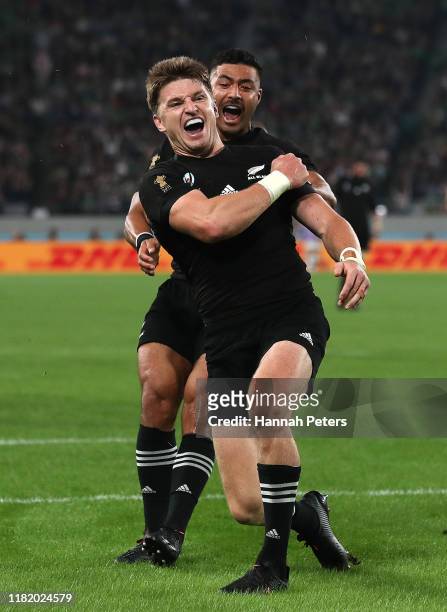 Beauden Barrett of New Zealand celebrates scoring his side's third try with teammate Richie Mo'Unga during the Rugby World Cup 2019 Quarter Final...