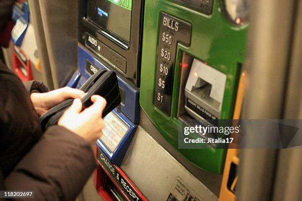 woman buying metrocard - new york city - new metro line stock pictures, royalty-free photos & images