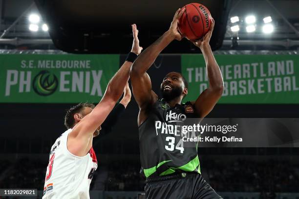 Keith Benson of the Phoenix drives to the basket during the round three NBL match between the South East Melbourne Phoenix and the Illawarra Hawks on...